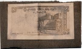 Rs. 1 notes with a wrappe...