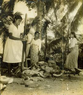 Women Pound Coconut Husks...