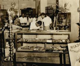 A CID MAN DUSTING ONE OF ...
